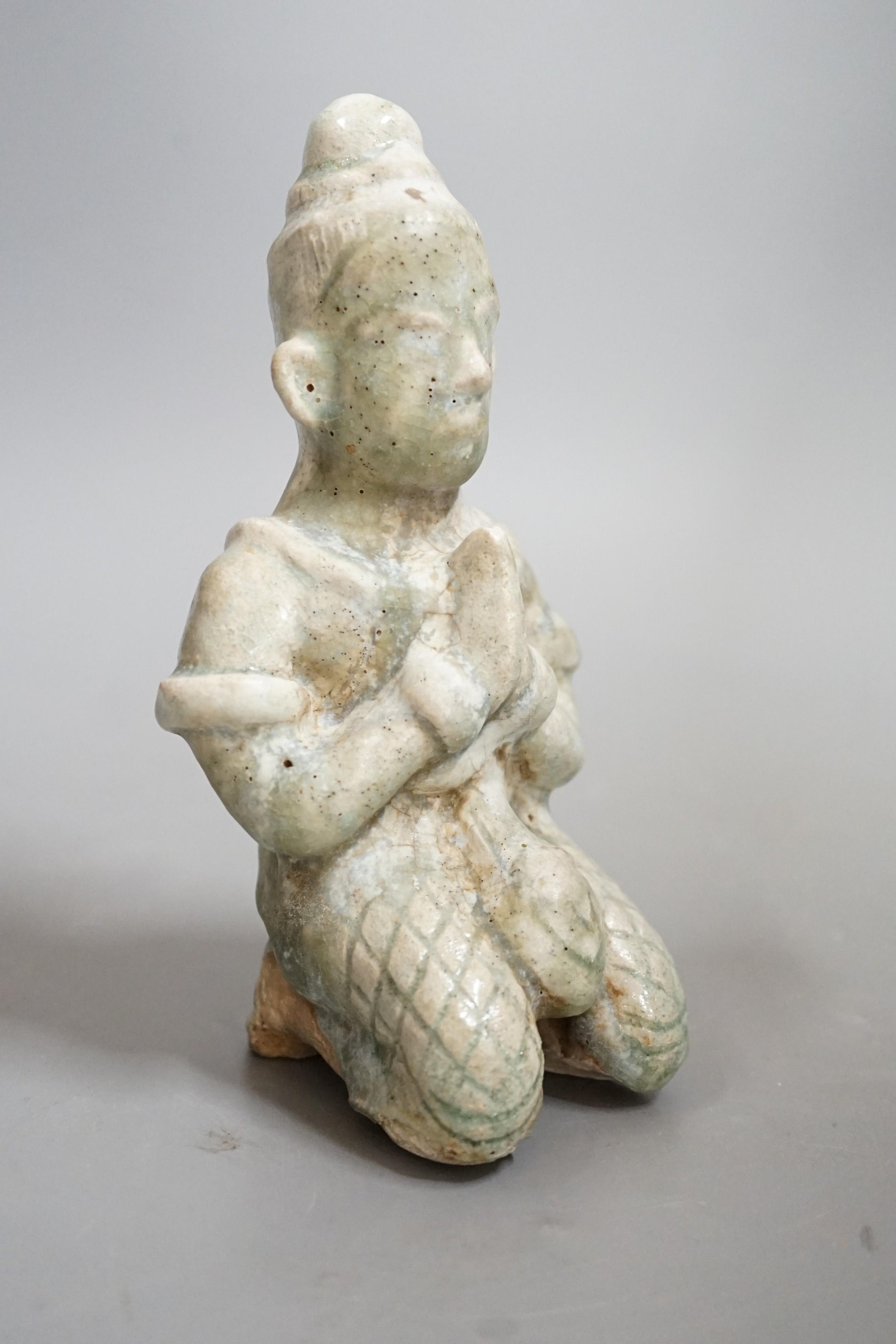 A Thai celadon Buddhist figure, Si Satchanalai, c.1450-1599, 18cms high